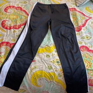 Black sweatpants with white stripe